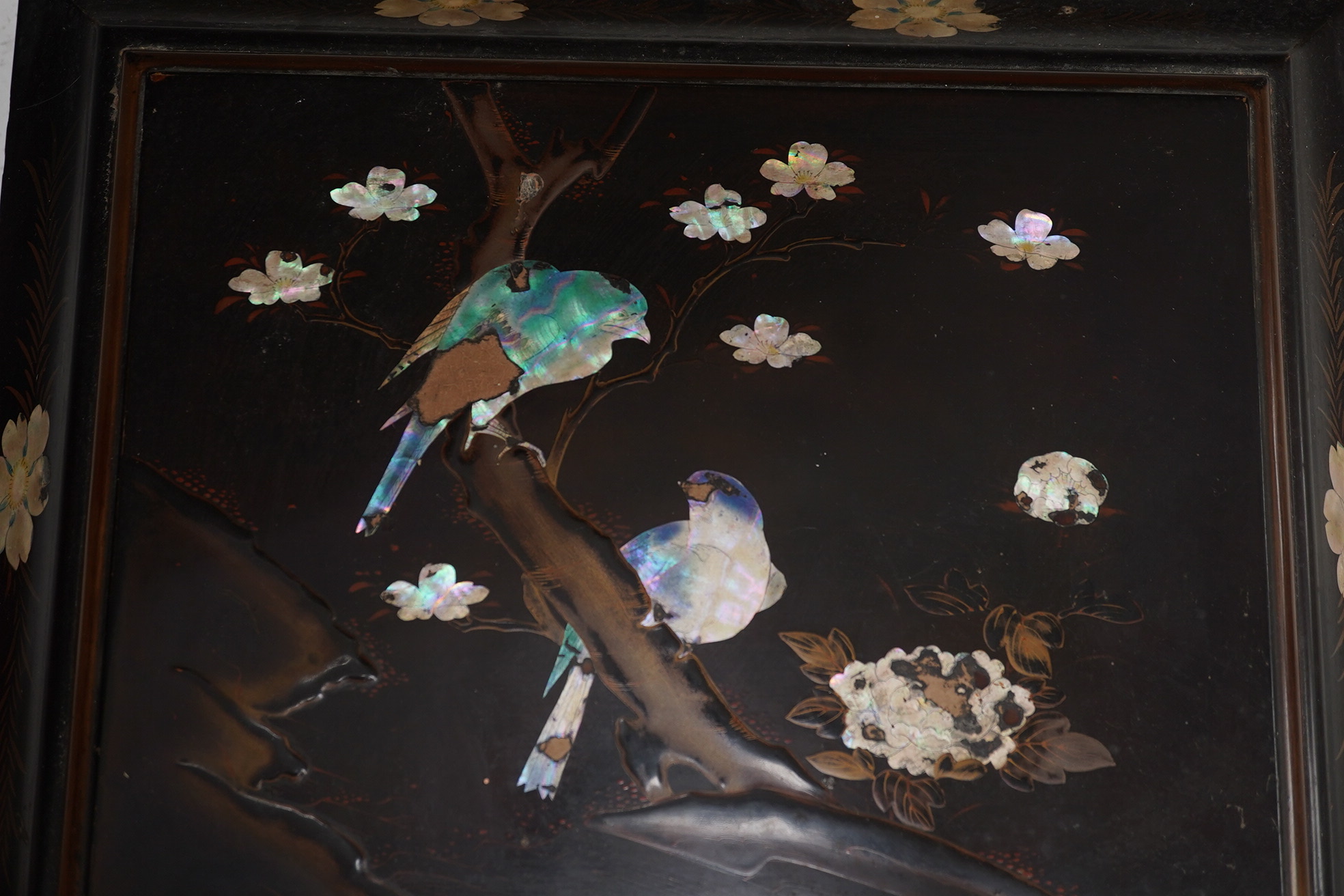 A Japanese lacquered box with mother of pearl inlay of birds and flowers, 35.5cm wide. Condition - worn on the outside to be expected, inside good